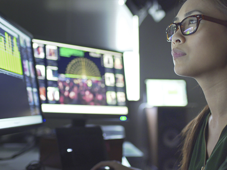 Woman Looking at Screens